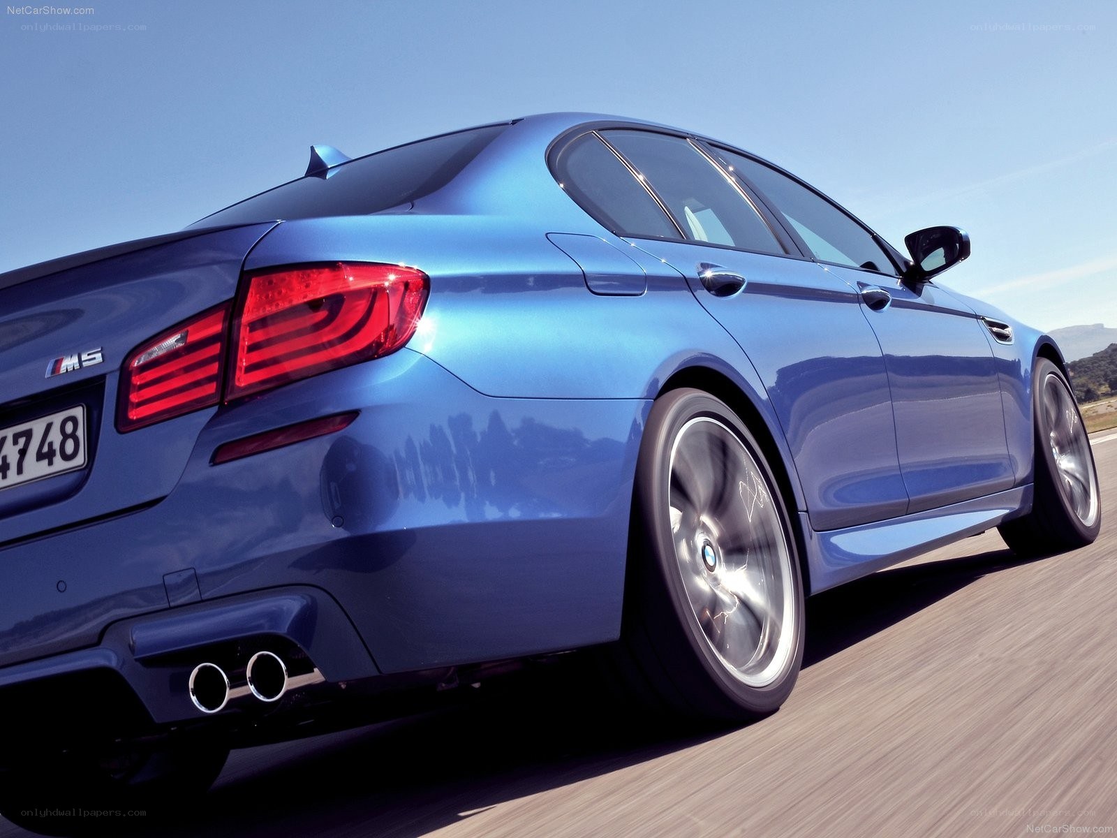 blue bmw m5 in motion