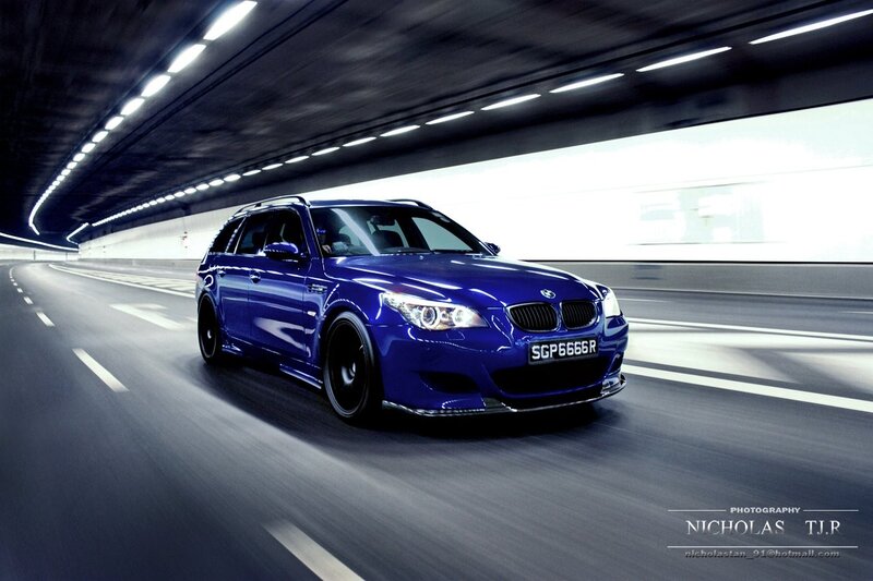 blue bmw m5 in tunnel