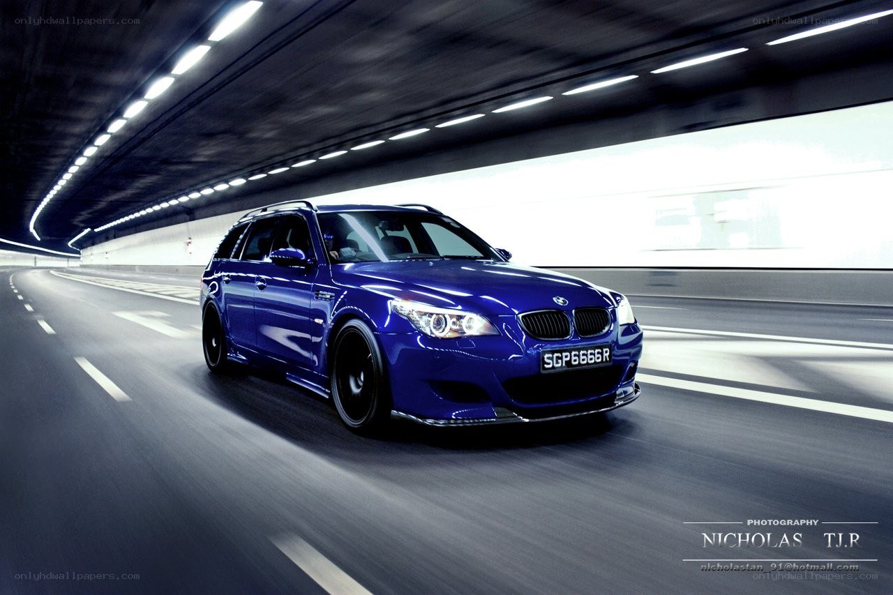 blue bmw m5 in tunnel