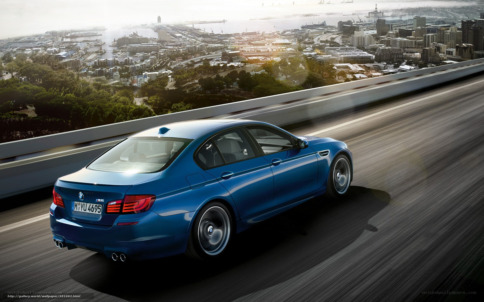 Blue BMW M5 on a highway