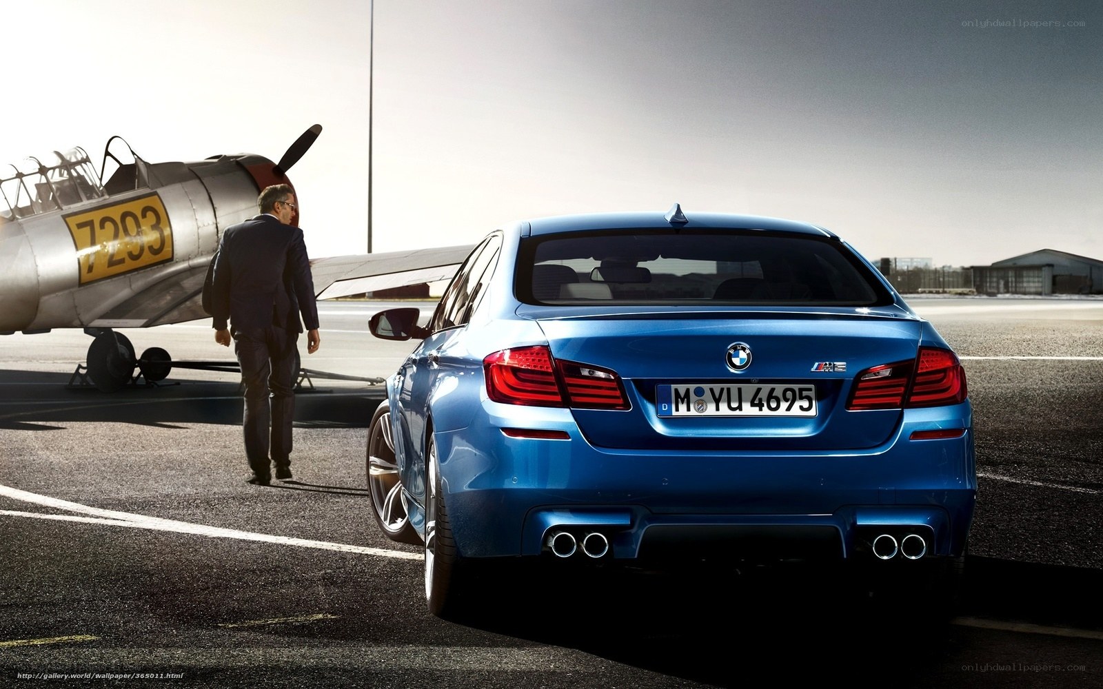 Blue BMW M5 on airfield