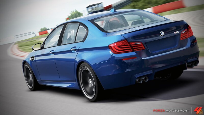 blue bmw m5 on racetrack