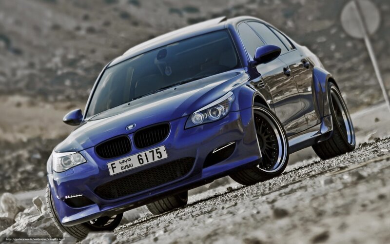blue bmw m5 on rocky terrain