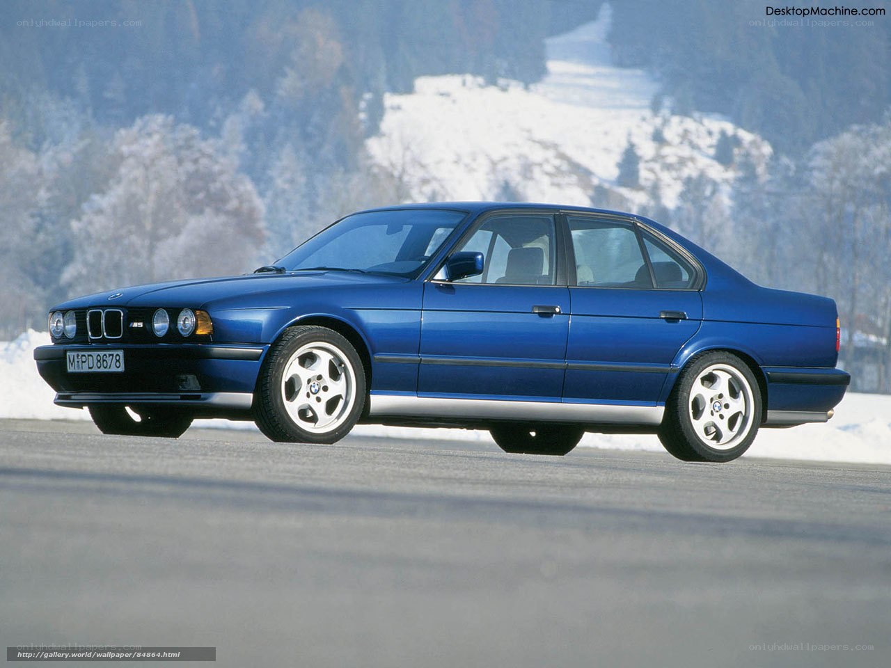 Blue BMW M5 on snowy road
