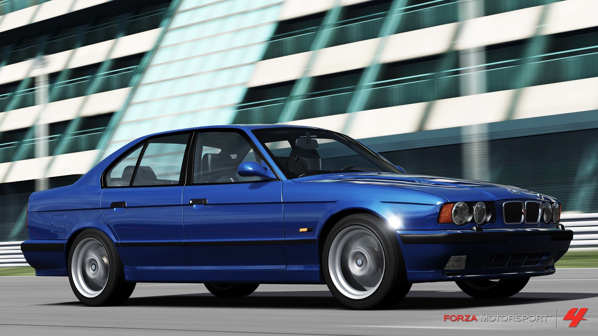 blue bmw m5 on track