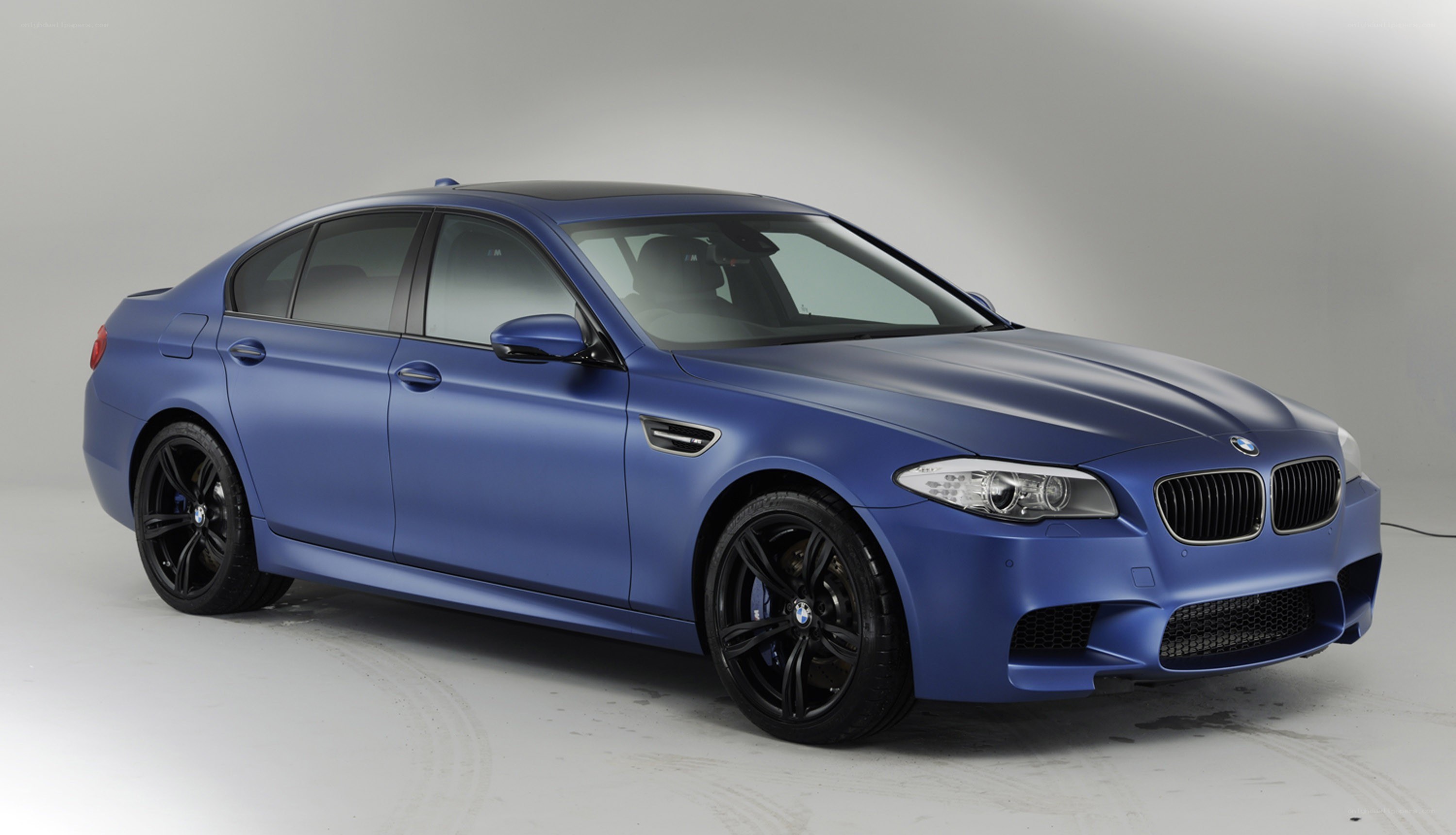 blue bmw m5 sedan