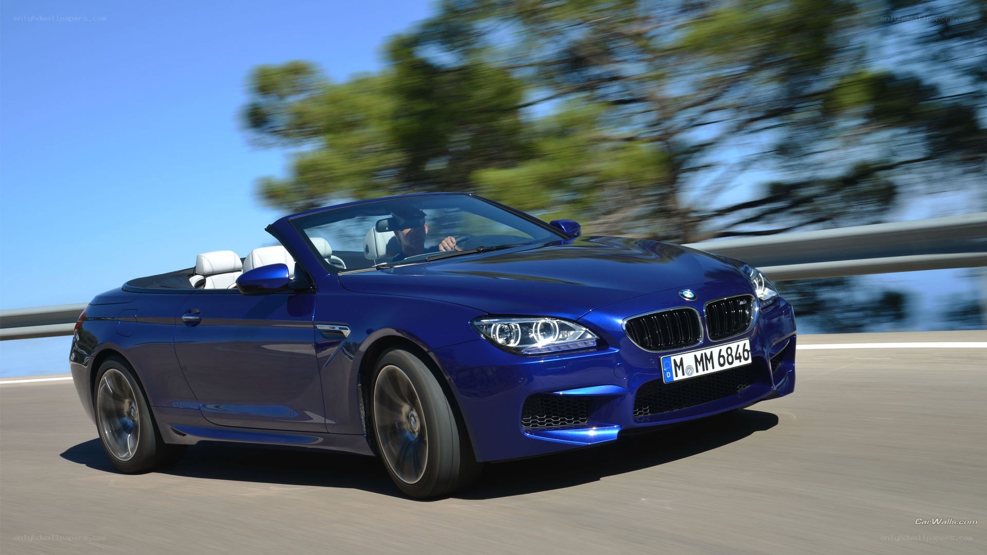 blue bmw m6 convertible driving