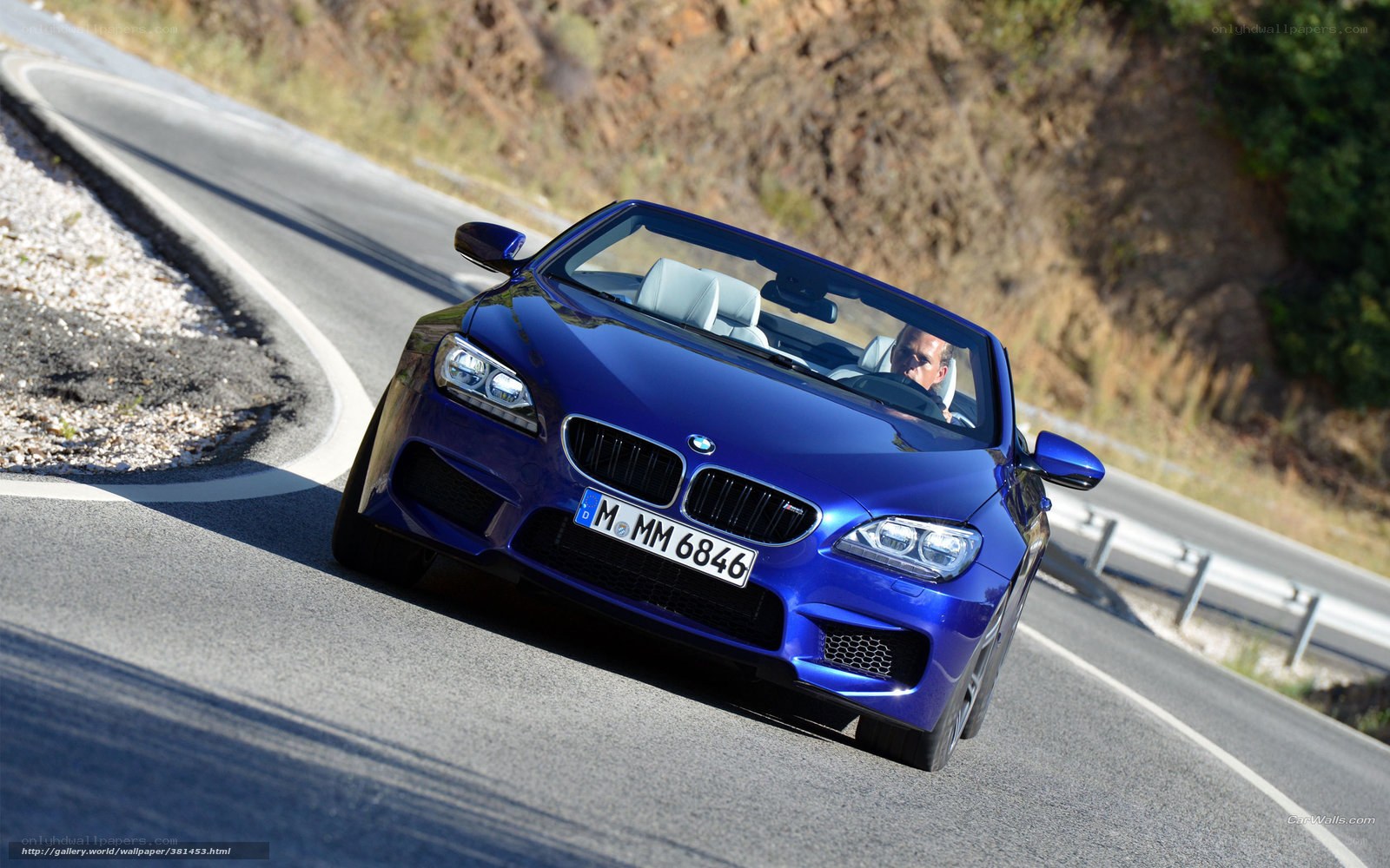 blue bmw m6 convertible on road