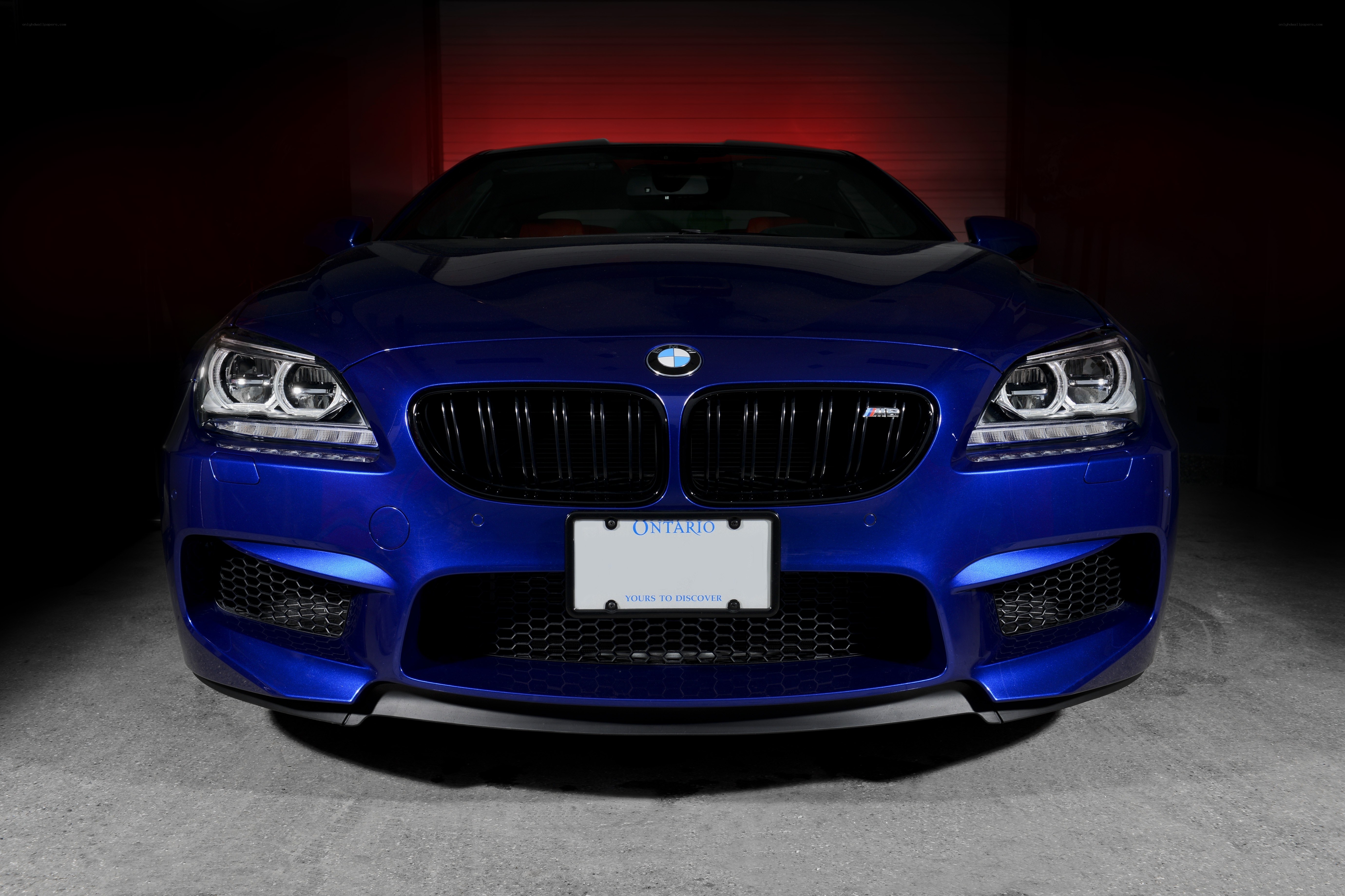 Blue BMW M6 in garage