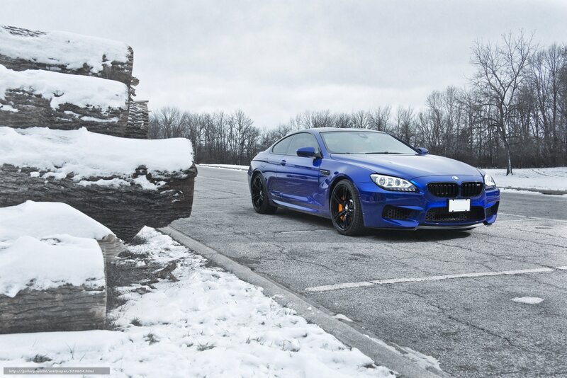 Blue BMW M6 in snowy parking lot