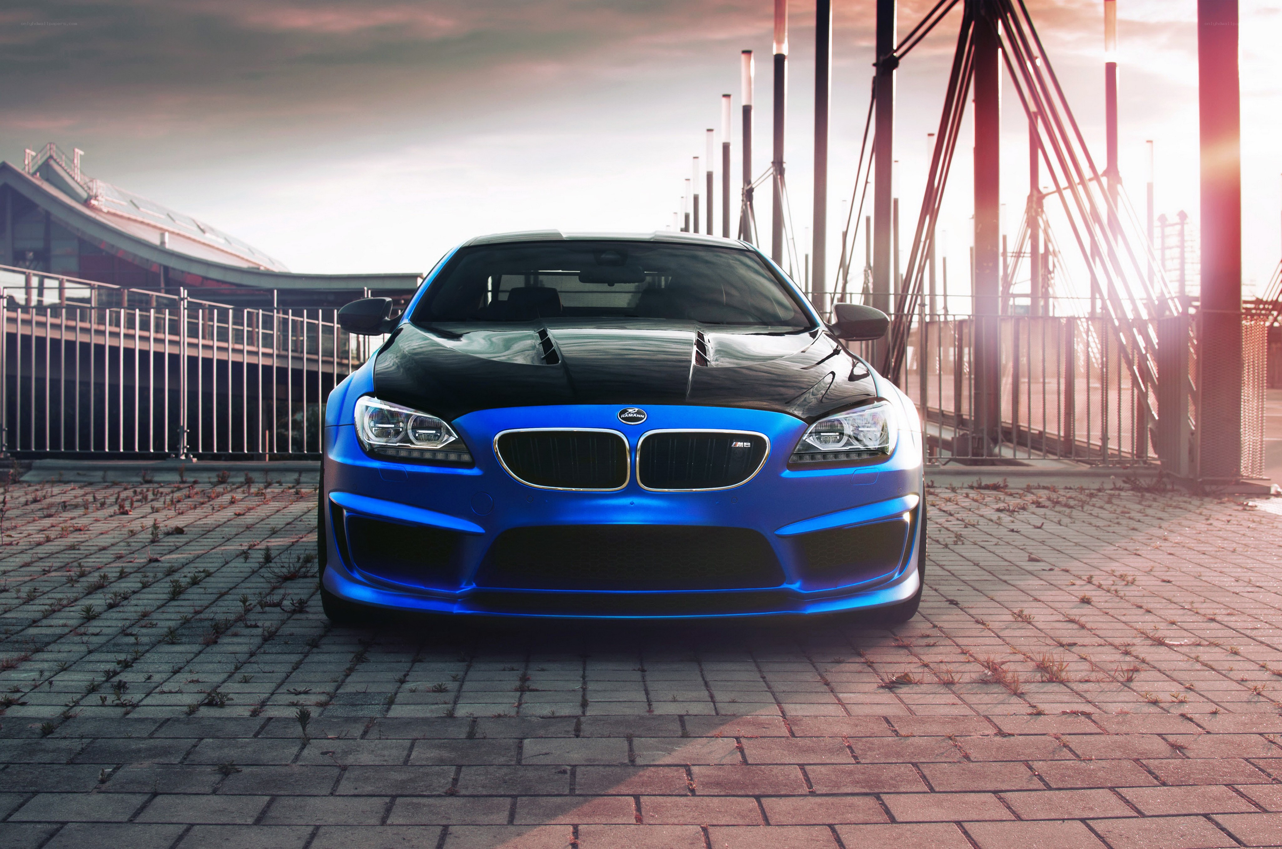 Blue BMW M6 on a bridge