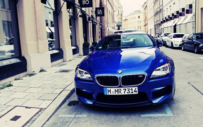 Blue BMW M6 on city street