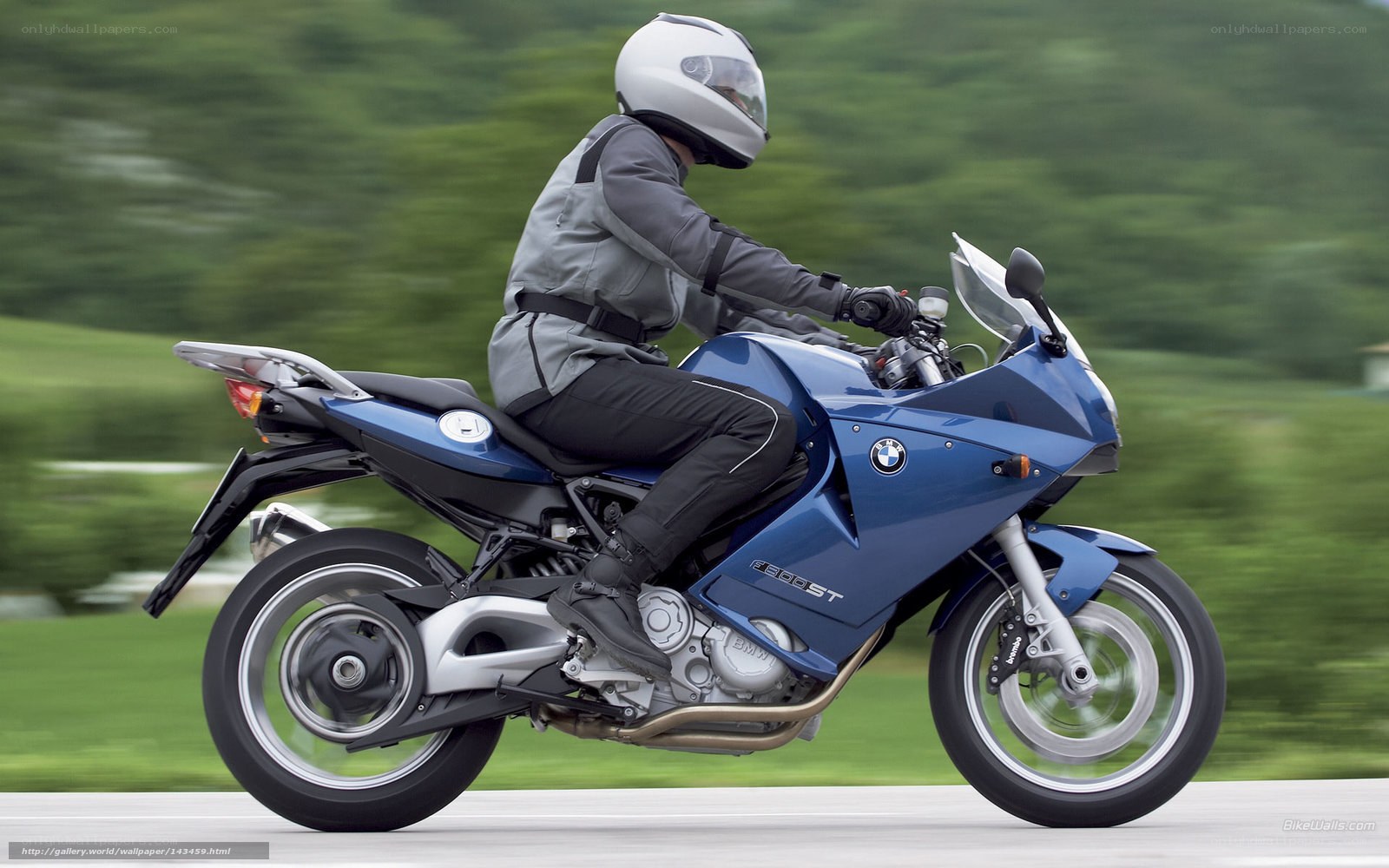 Blue BMW motorcycle in motion
