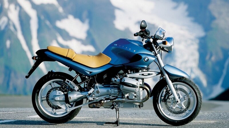 Blue BMW motorcycle on road