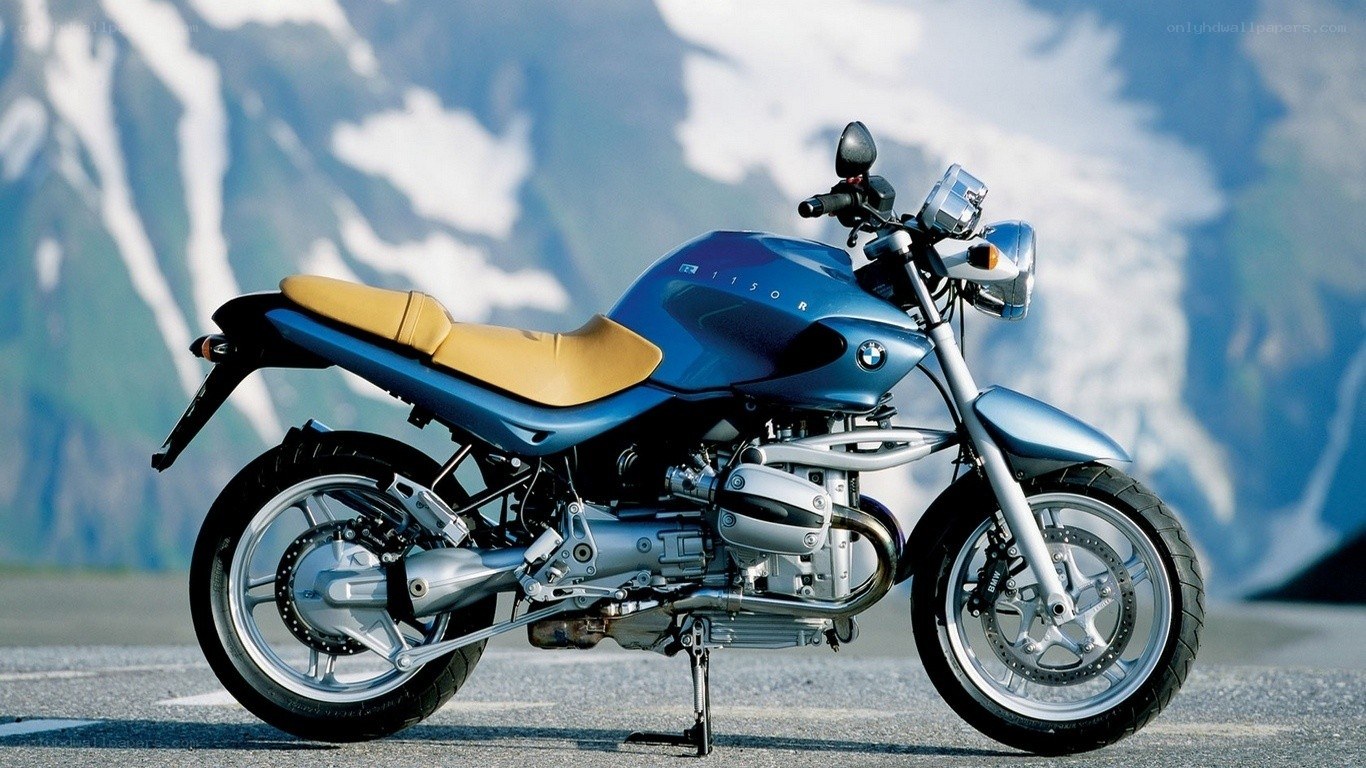 Blue BMW motorcycle on road