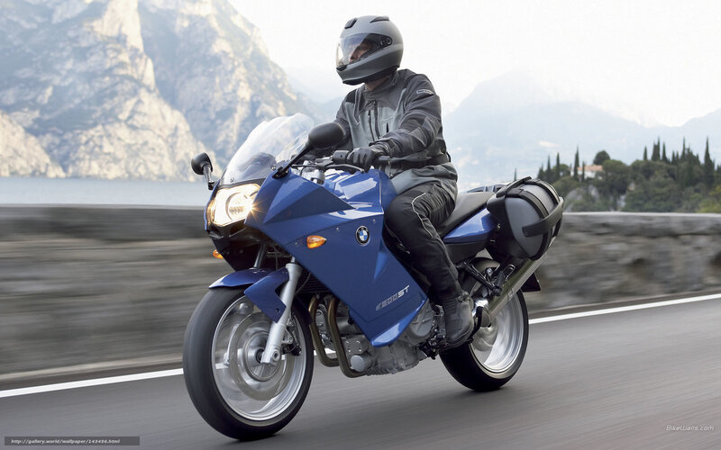 Blue BMW motorcycle on road