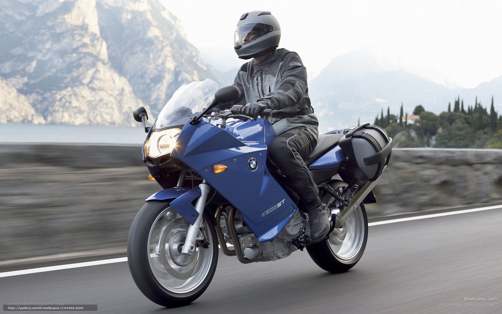 Blue BMW motorcycle on road