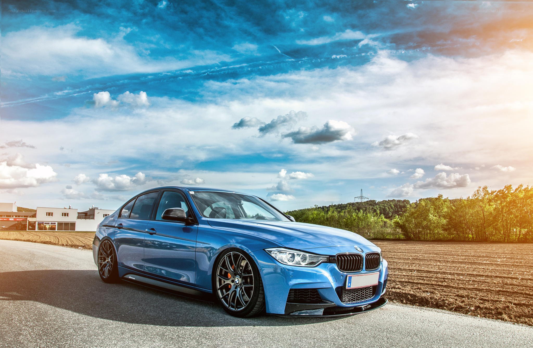 Blue BMW on a country road