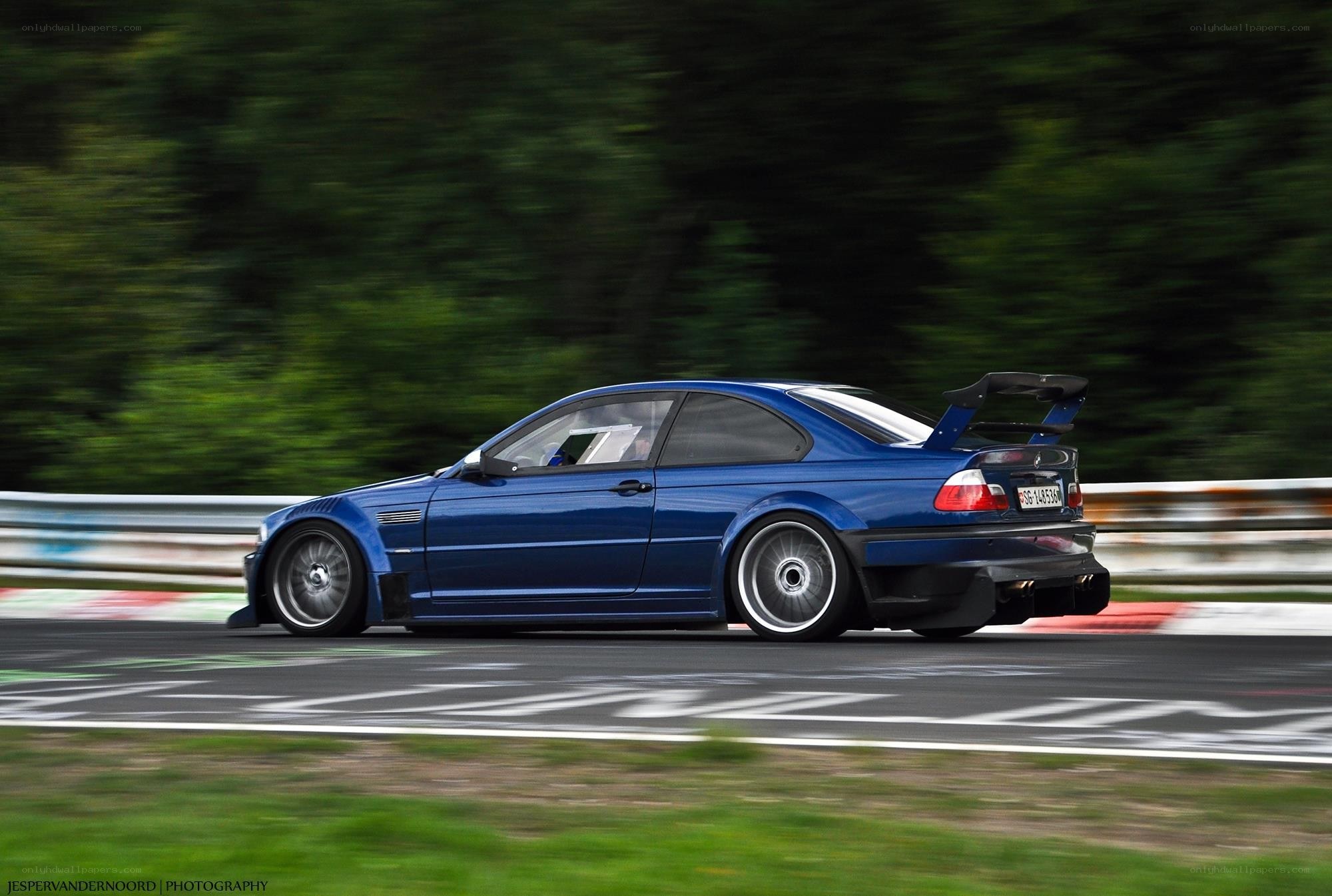 Blue BMW on a racetrack