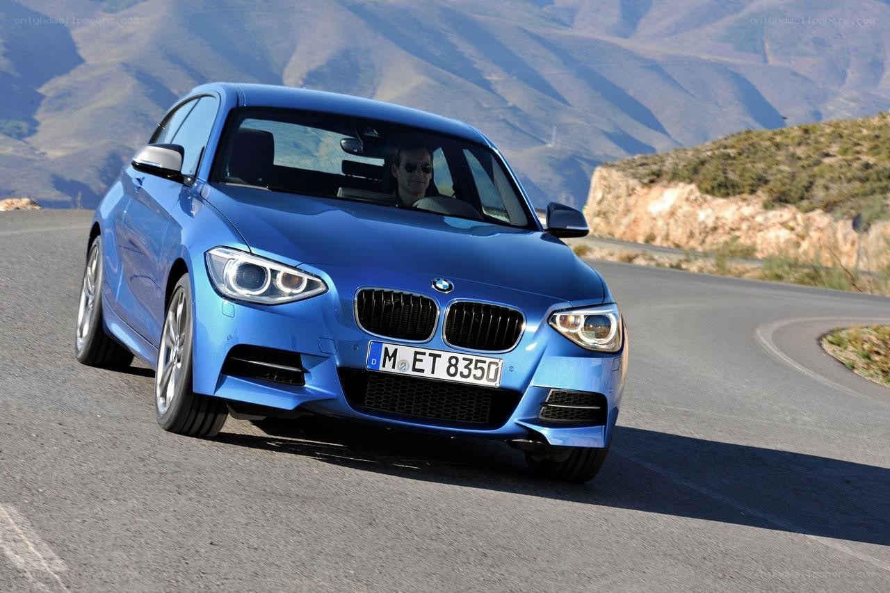 Blue BMW on a winding road