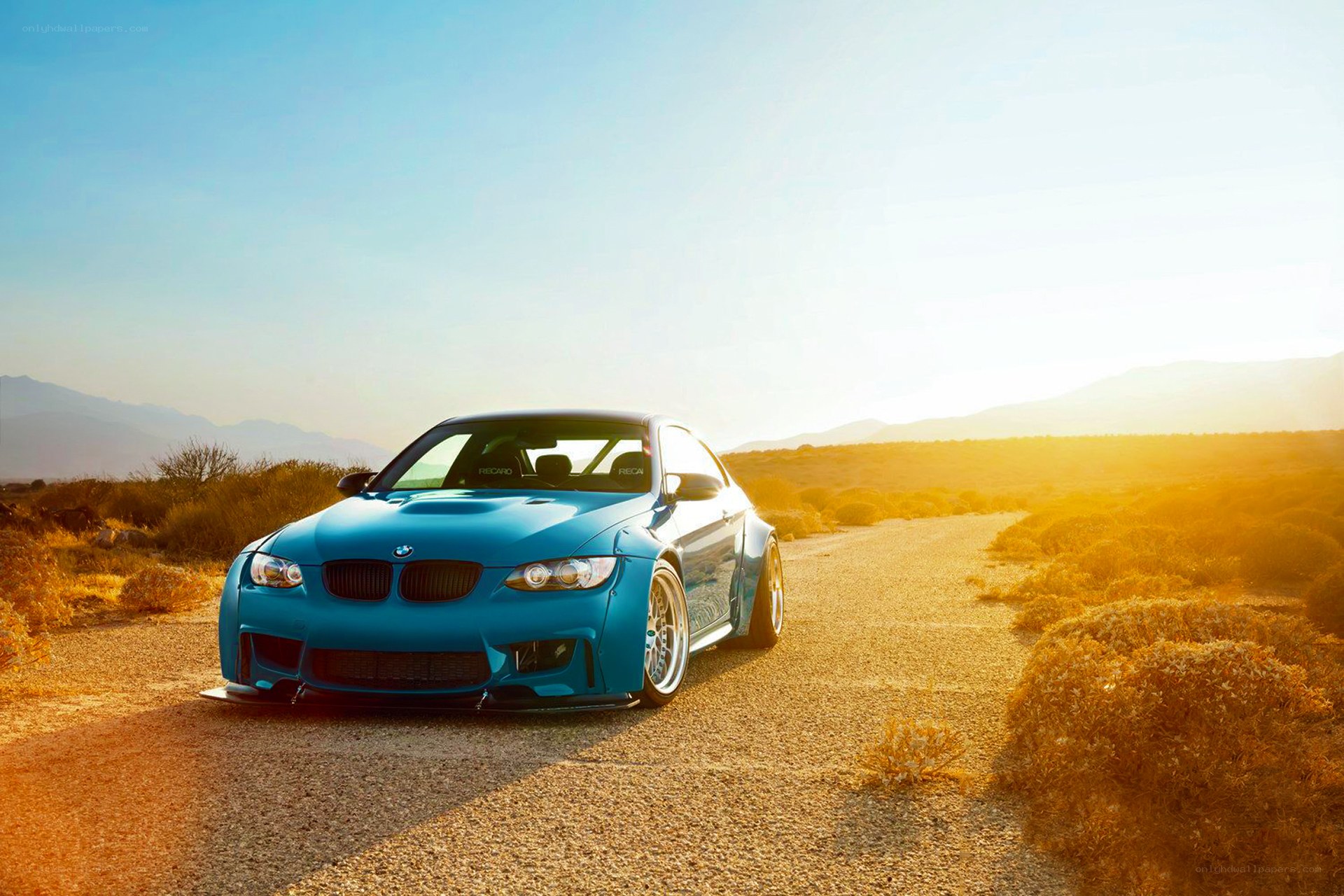 Blue BMW on desert road