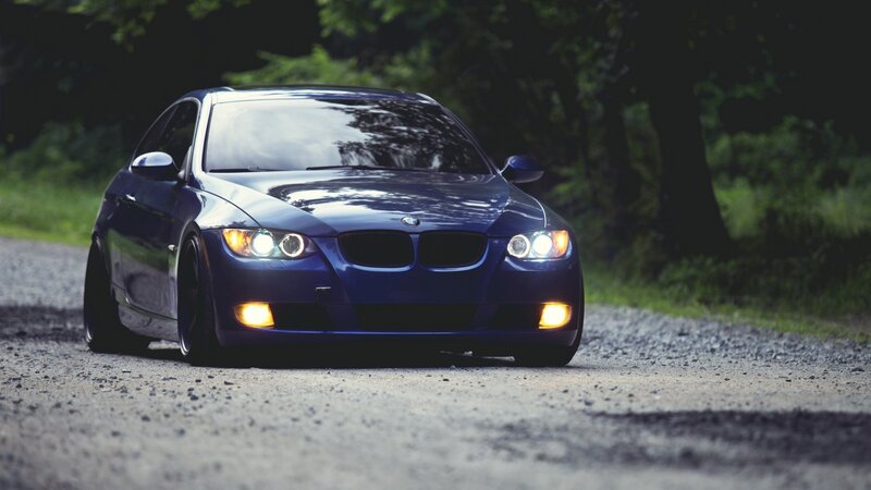 blue bmw on gravel road