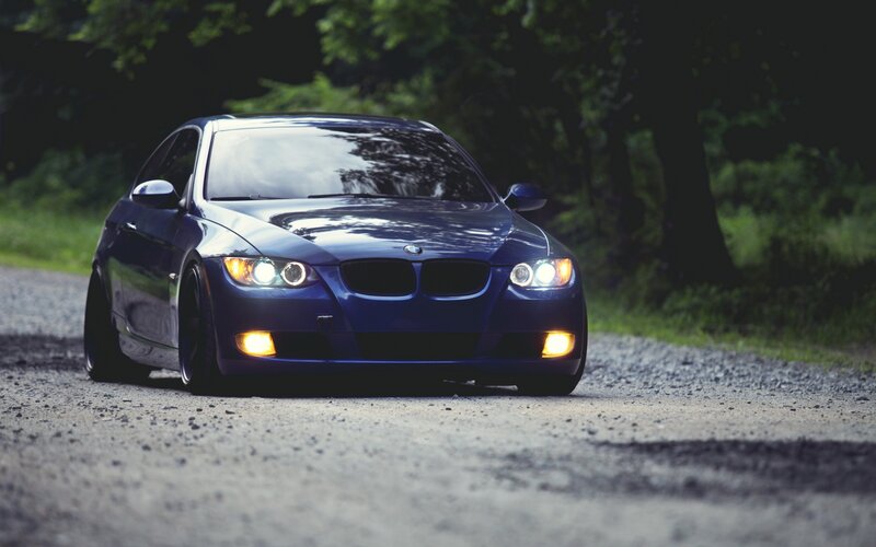 blue bmw on gravel road