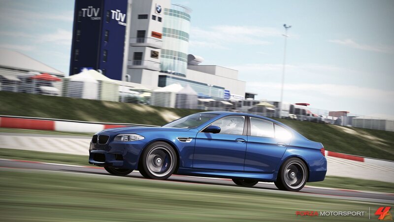 blue bmw on racetrack