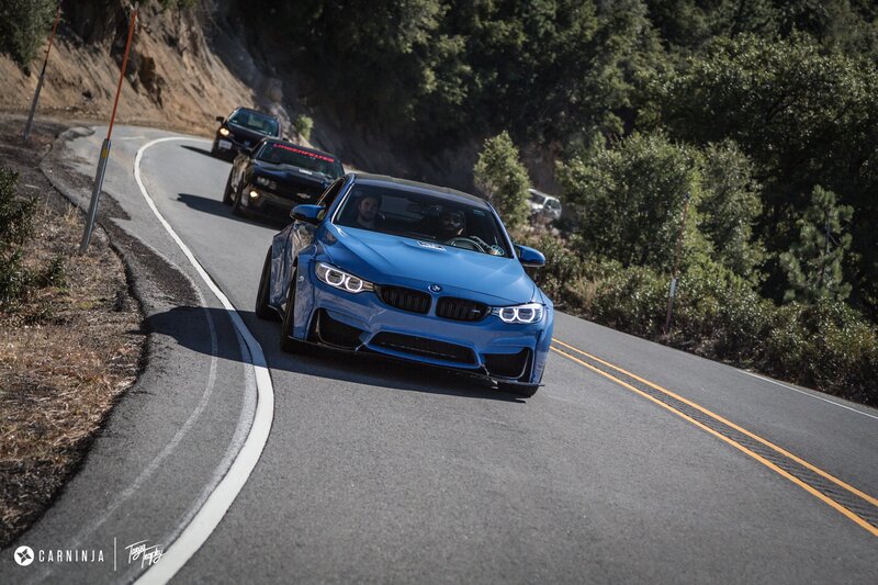 Blue BMW on Road