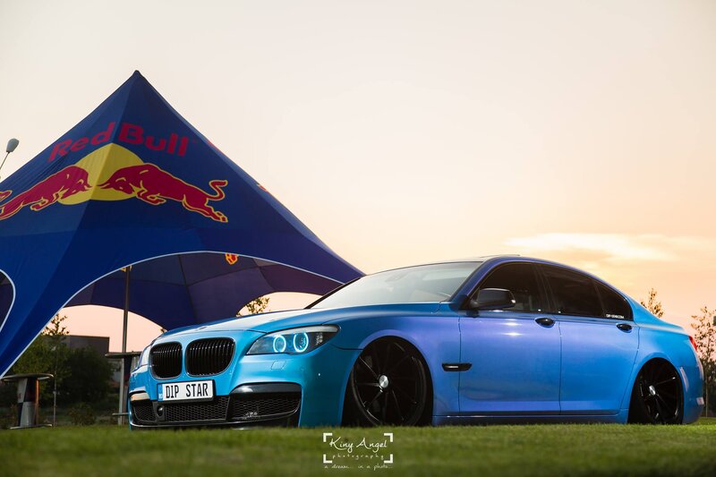 Blue BMW Sedan — Dramatic, Sunset