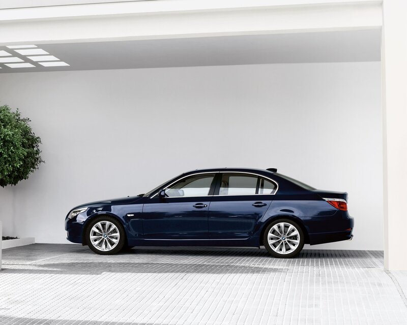 Blue BMW sedan in garage