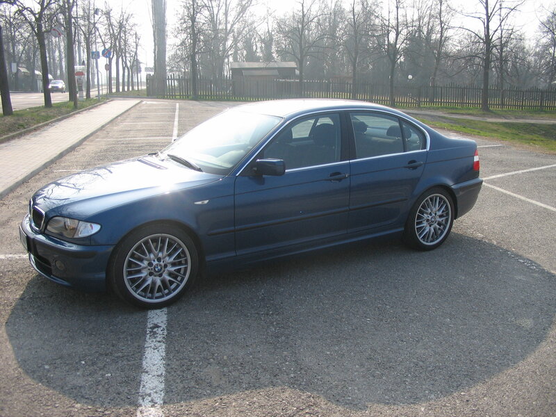 Blue BMW sedan parked