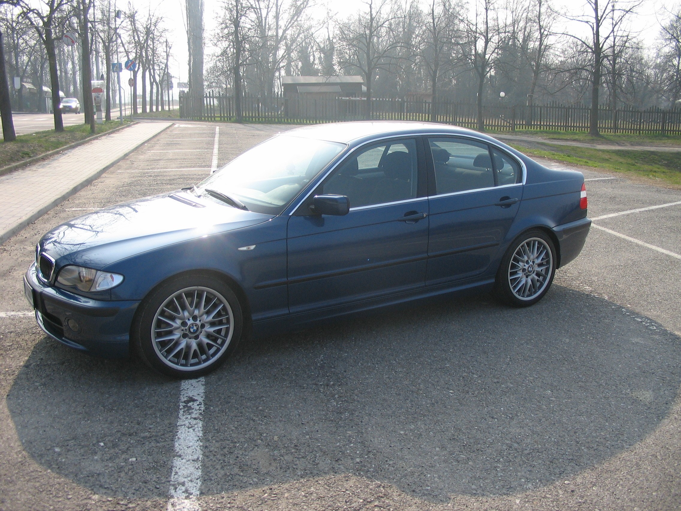 Blue BMW sedan parked