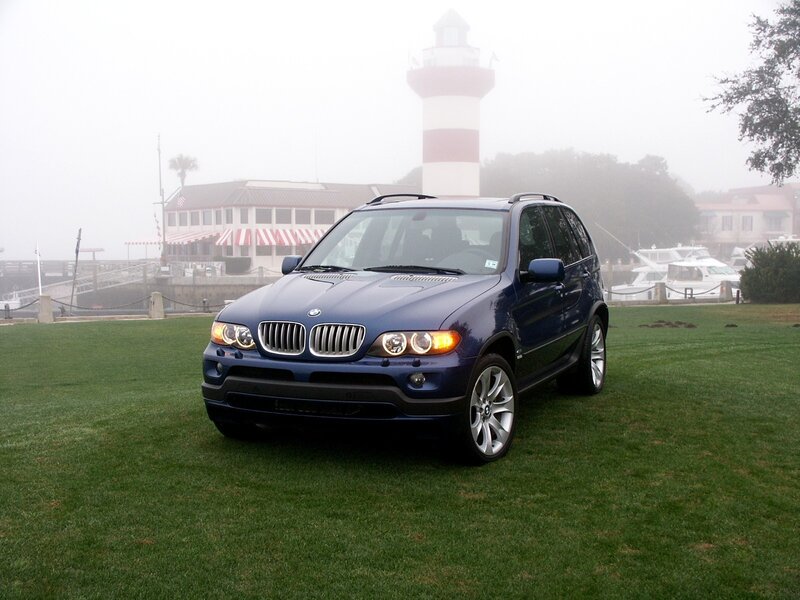 Blue BMW SUV on a foggy day