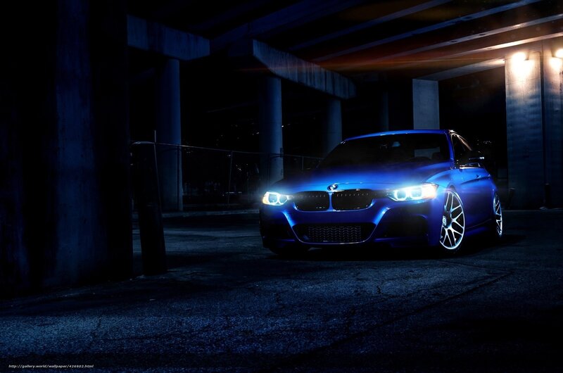blue bmw under bridge
