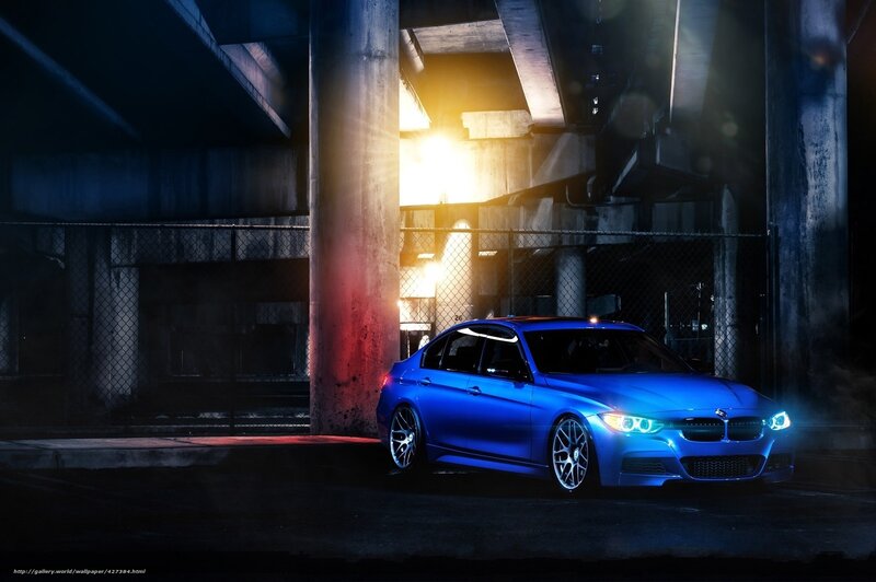 Blue BMW under highway