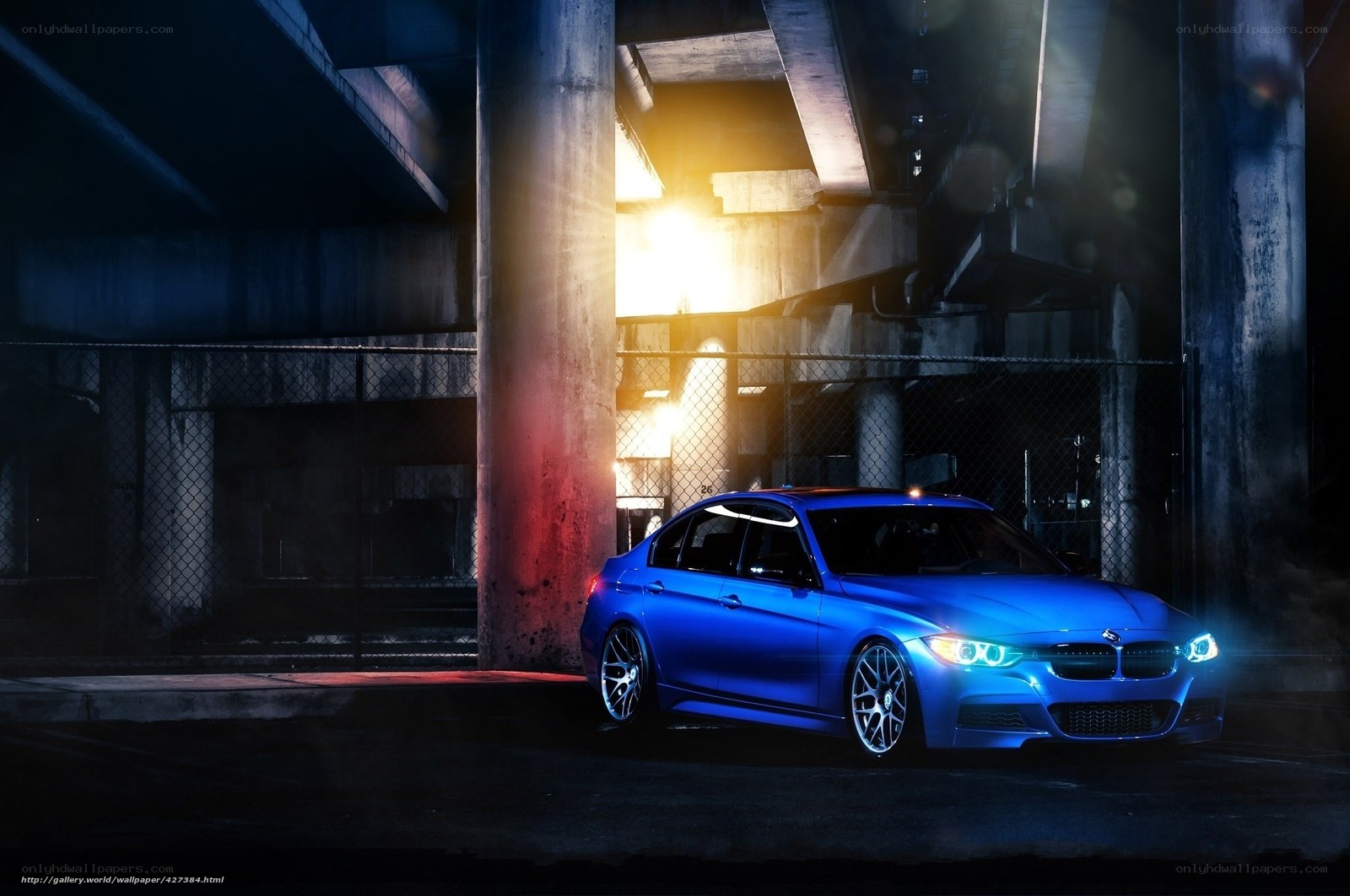 Blue BMW under highway