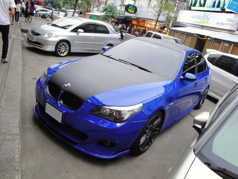 Blue BMW with black hood