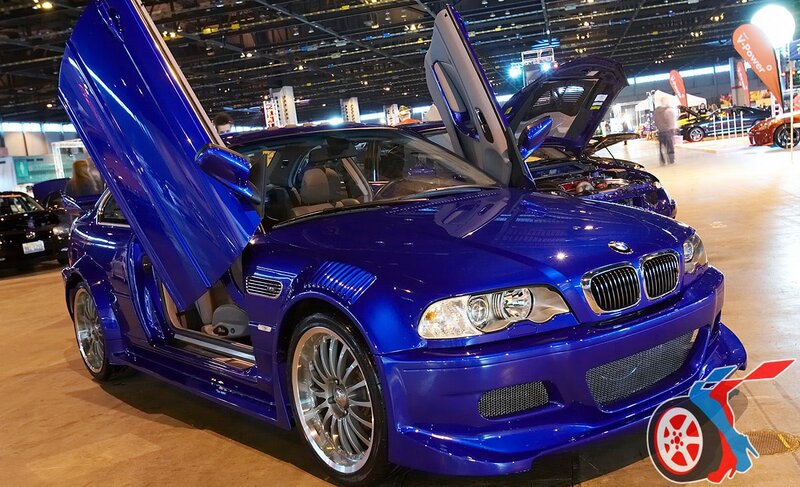 Blue BMW with doors open