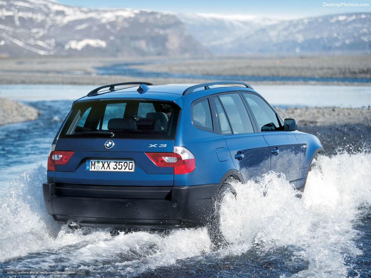 blue bmw x3 crossing river