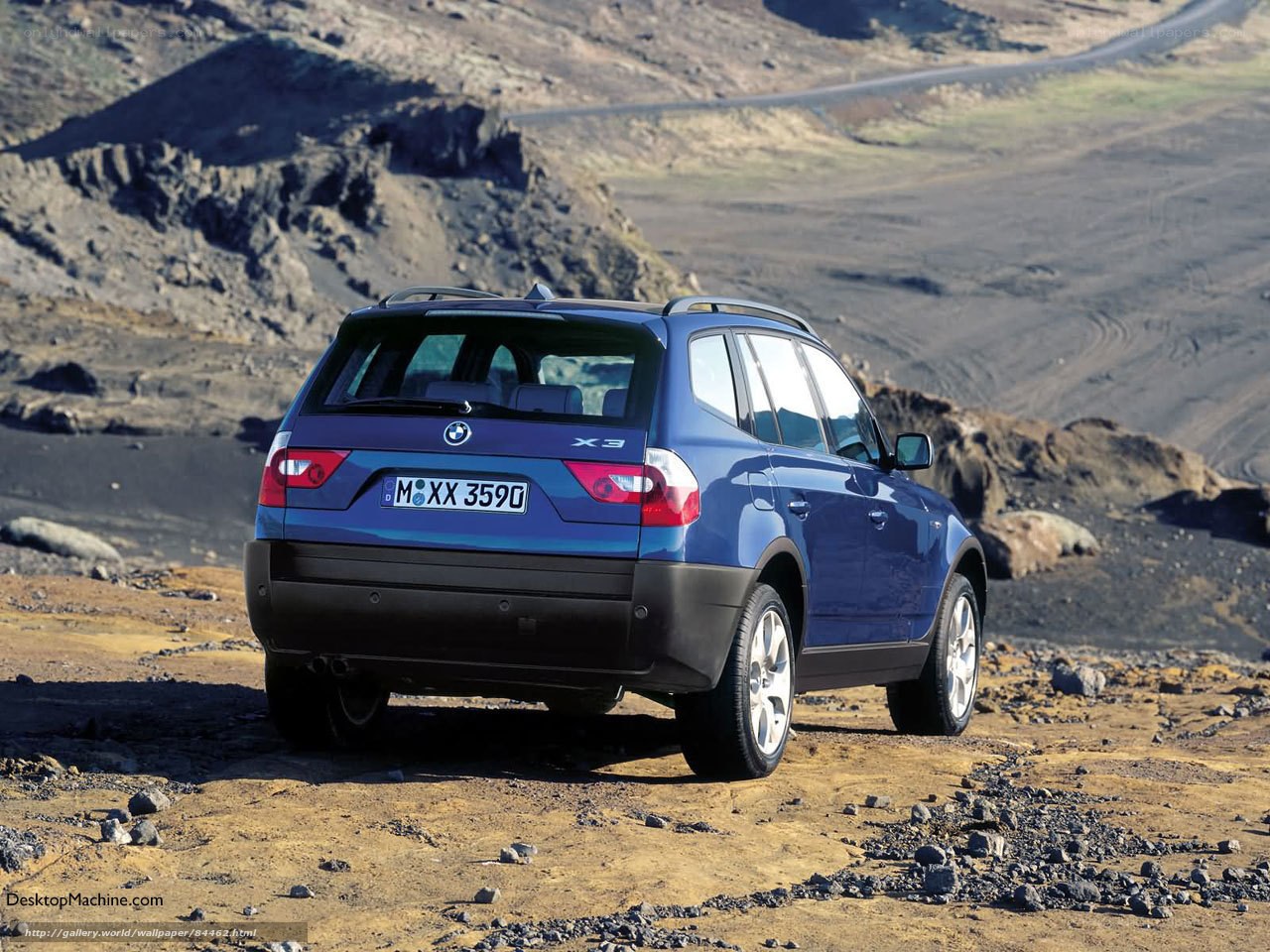 Blue BMW X3 in rugged terrain