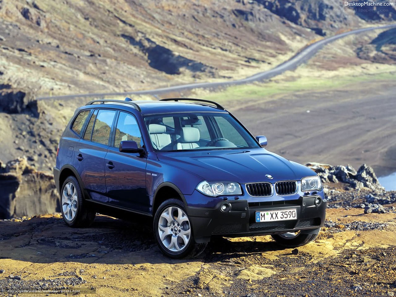 Blue BMW X3 on a rugged road