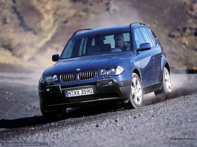 Blue BMW X3 on gravel road