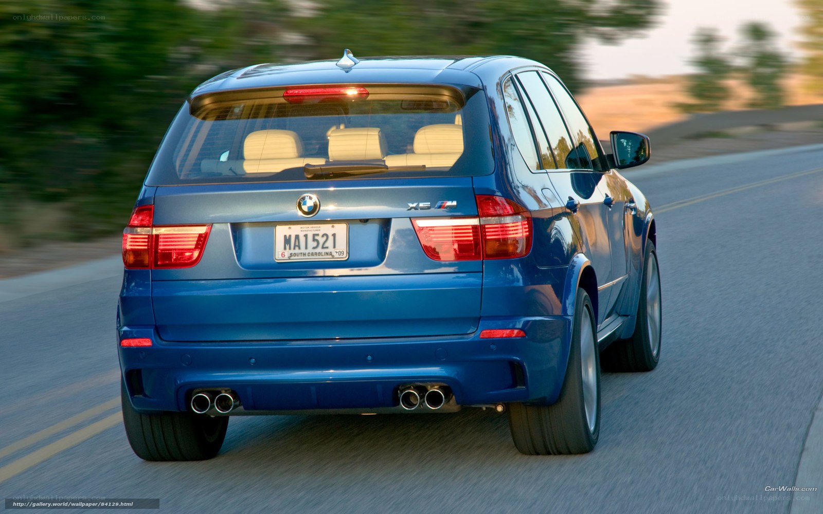 blue bmw x5 m driving
