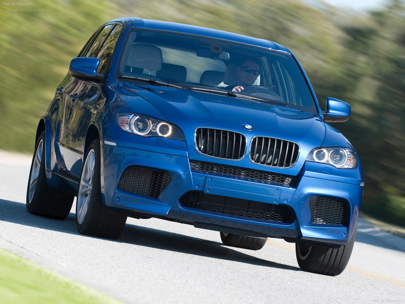 Blue BMW X5 M in motion