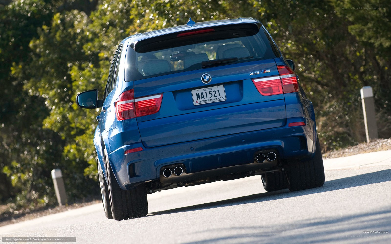 blue bmw x5 m on road