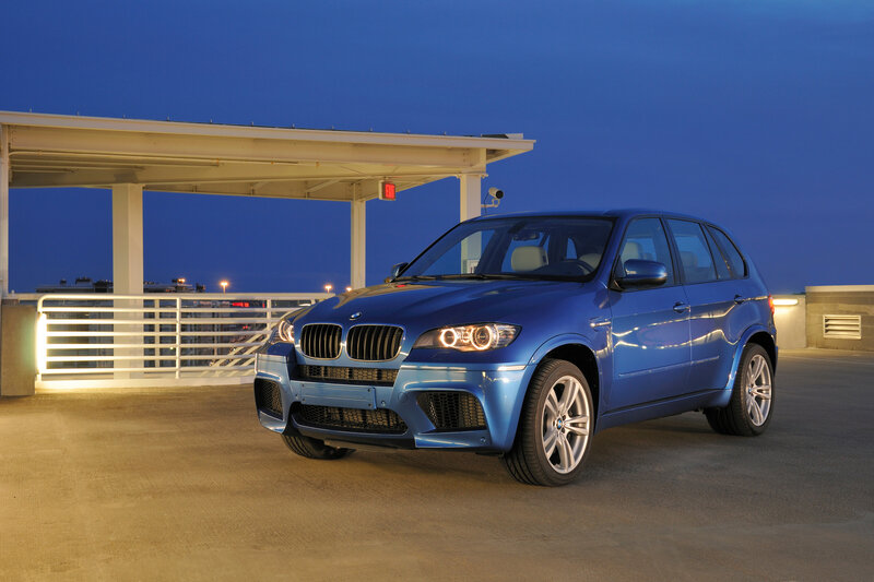Blue BMW X5 M parked at night