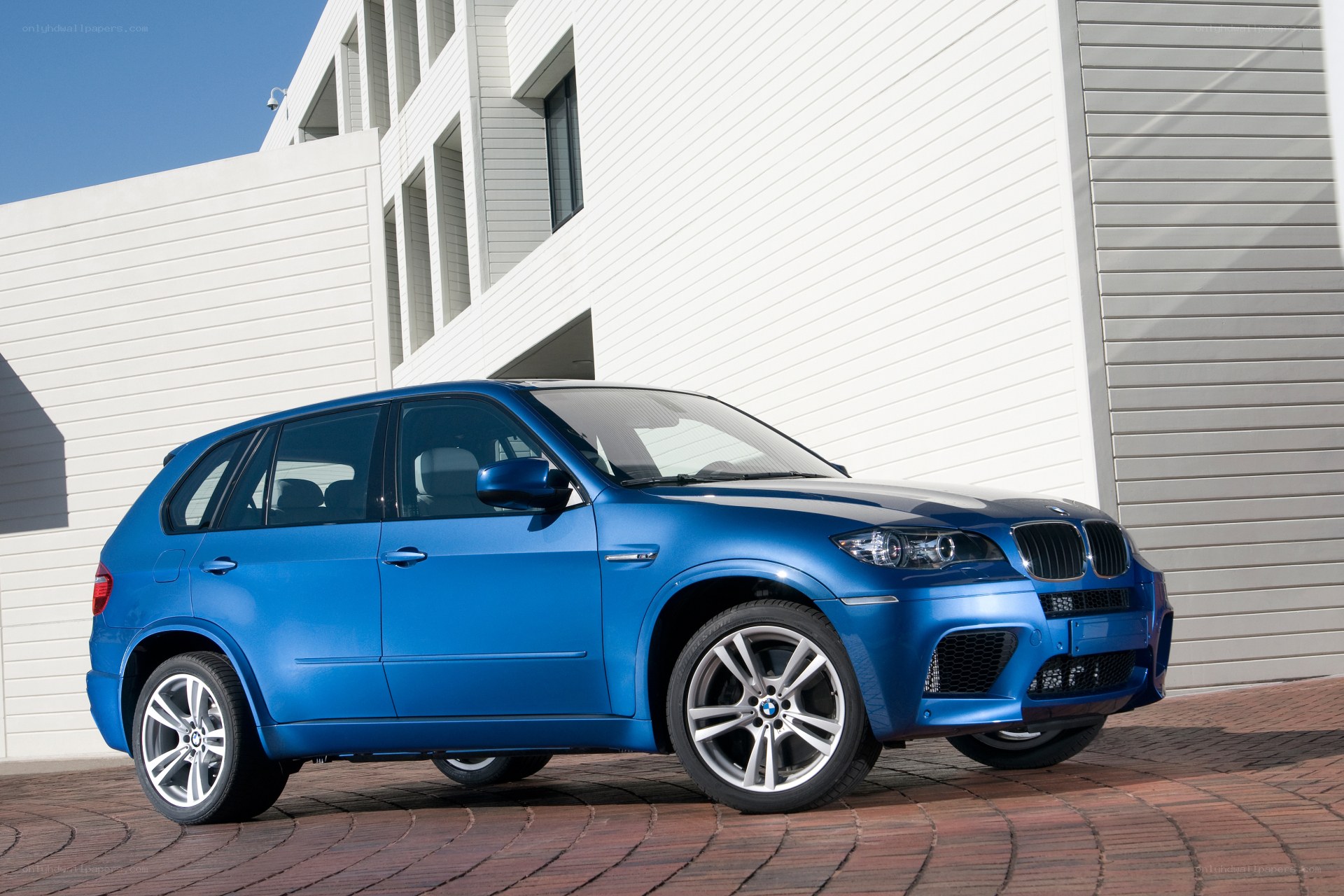 Blue BMW X5 M parked outside