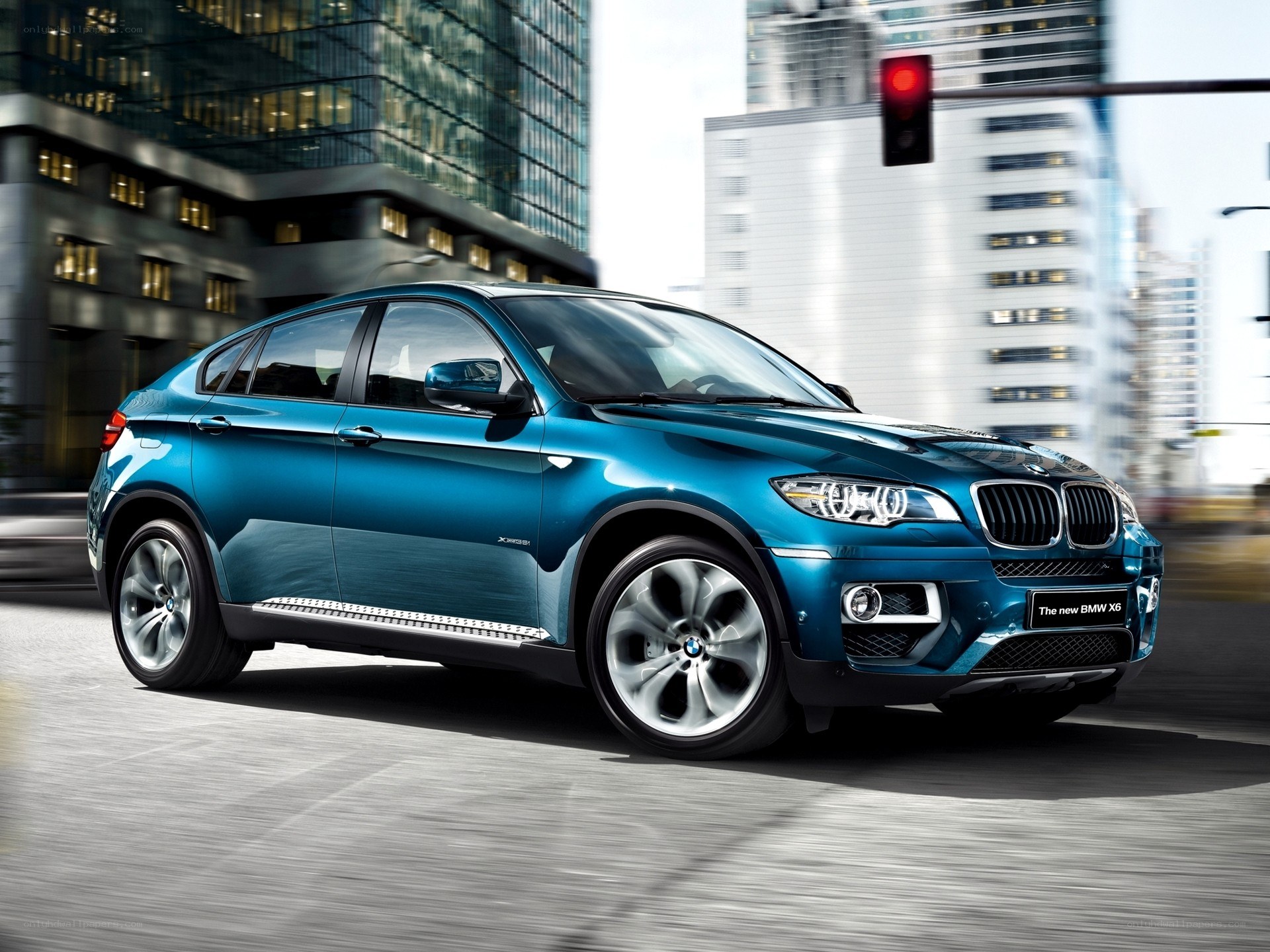 Blue BMW X6 in city
