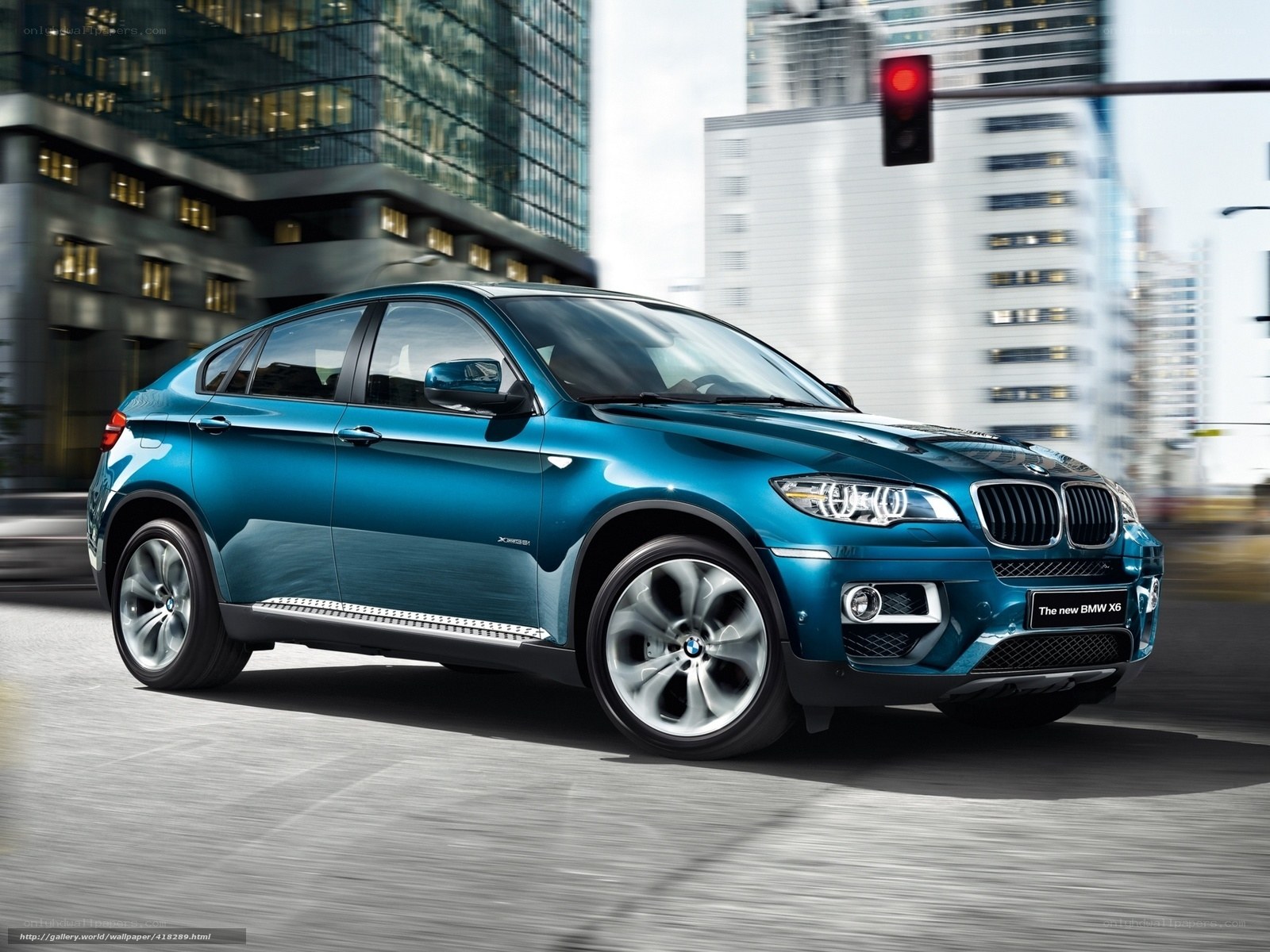 Blue BMW X6 in city